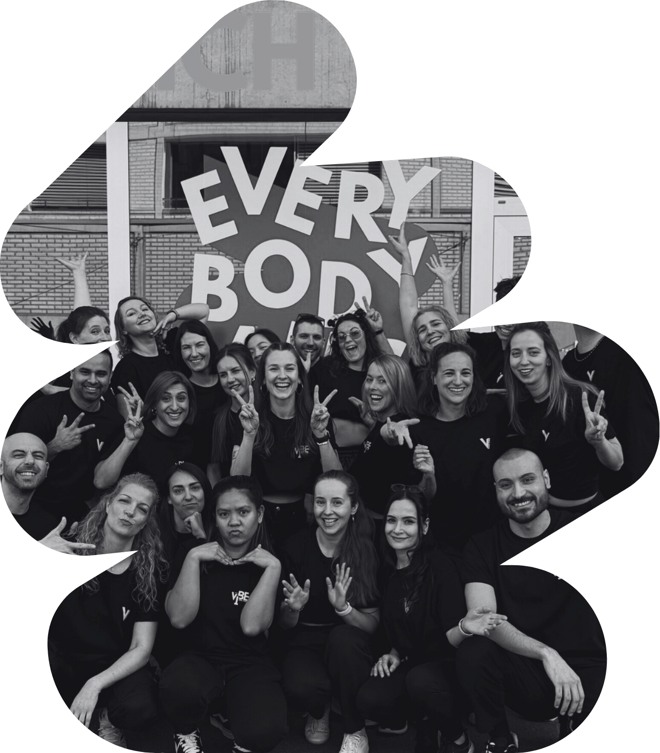 Dance crew smiling and posing together after a flashmob performance in Zurich city centre.